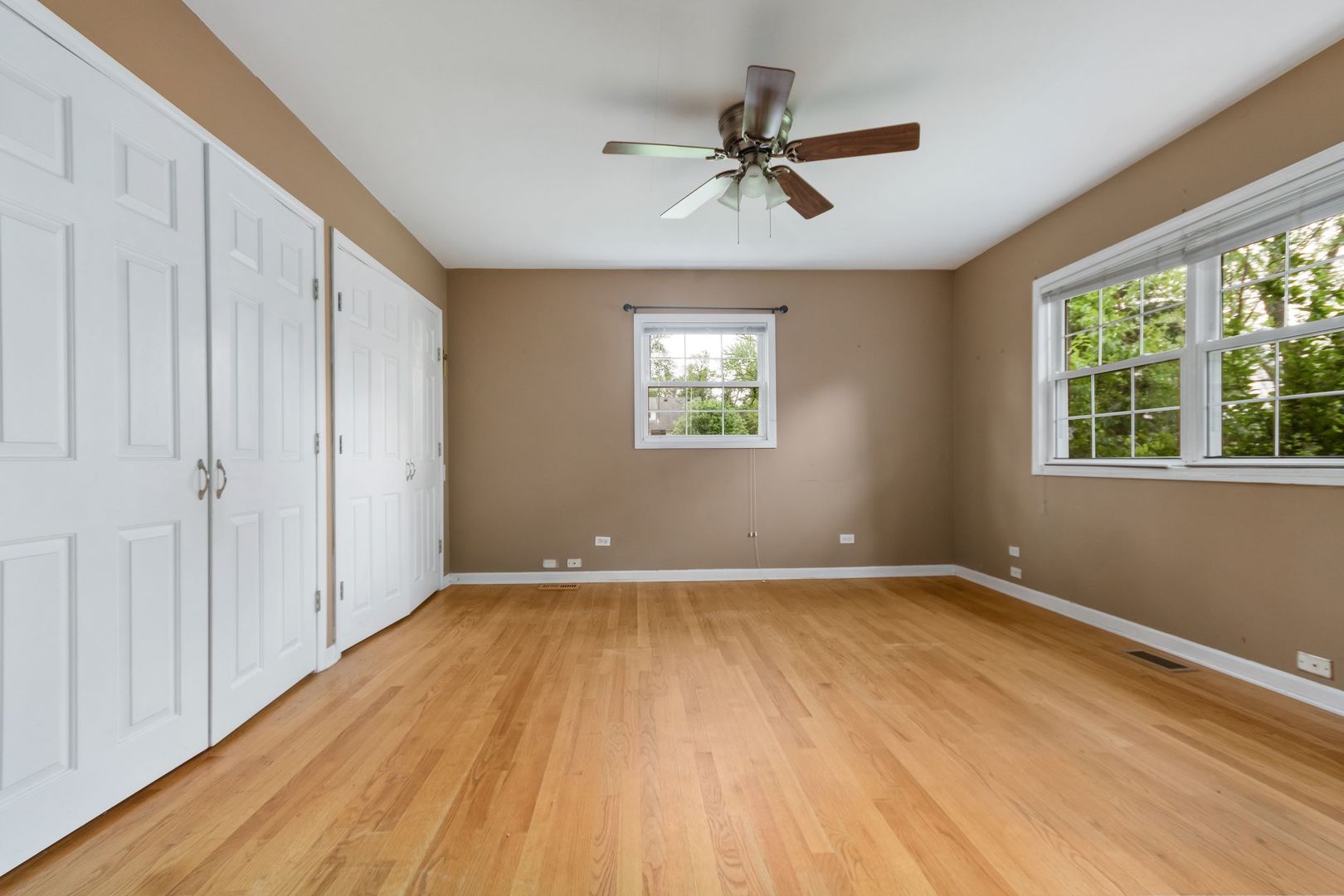 N659 Old Kirk Road West Chicago, IL 60185 - Photo 9 of 24 a view of a room with a wooden floor and windows