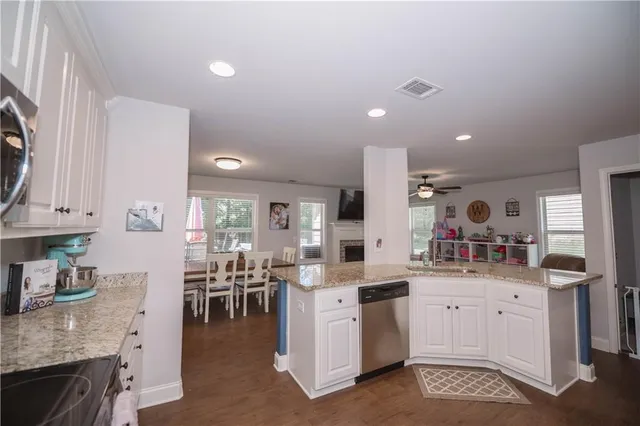 a kitchen with a sink stove and cabinets