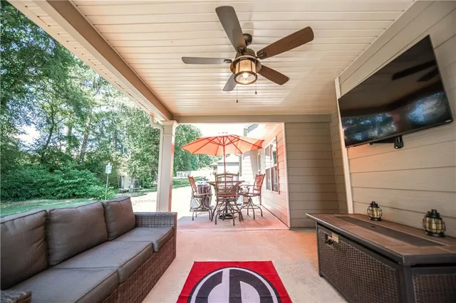a living room with furniture and a flat screen tv
