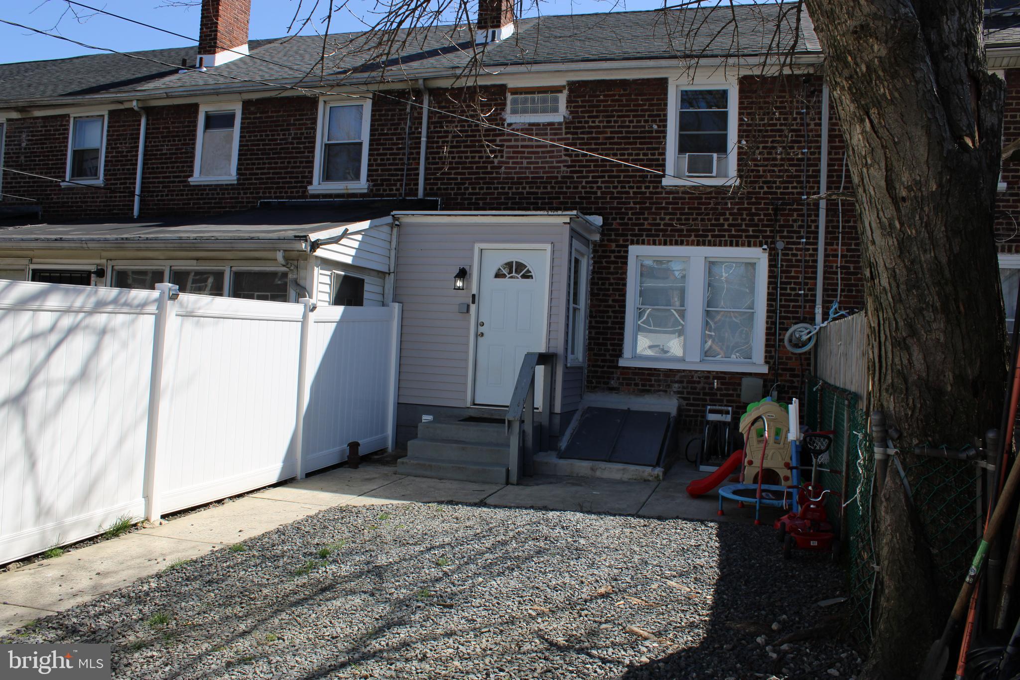 1211 South Octagon Road Camden, NJ 08104 - Photo 16 of 18 a view of a house with a yard