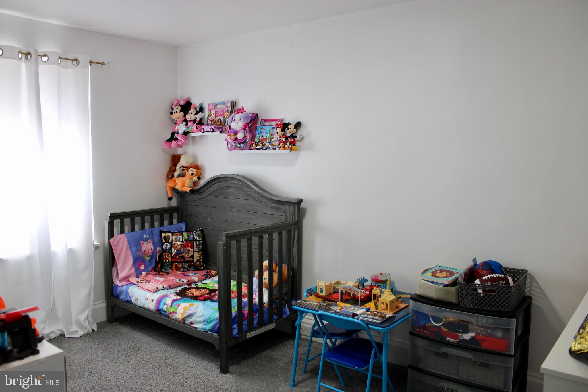 1211 South Octagon Road Camden, NJ 08104 - Photo 10 of 18 a bedroom with lots of furniture and baby