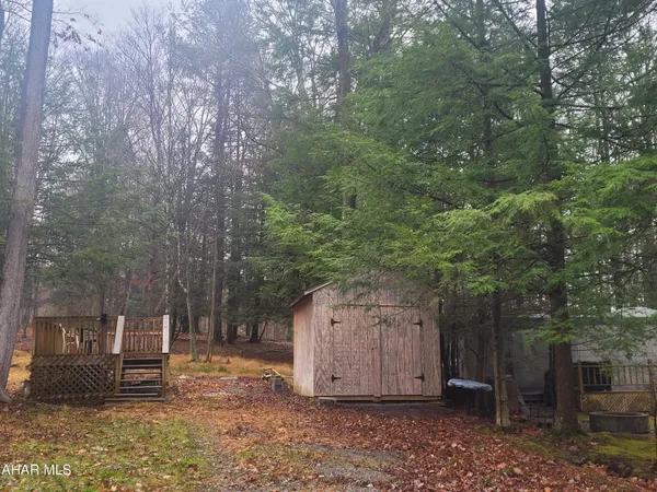 a wooden fence with trees