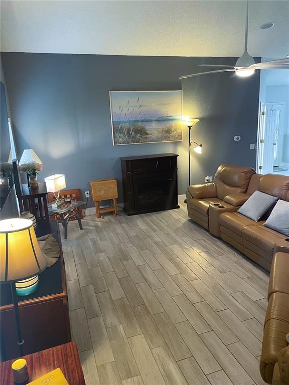 2571 Running Oak Court Spring Hill, FL 34608 - Photo 18 of 37 a living room with furniture and a fireplace