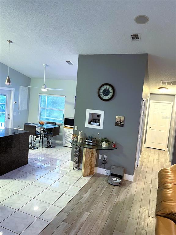 2571 Running Oak Court Spring Hill, FL 34608 - Photo 19 of 37 a living room with furniture and wooden floor