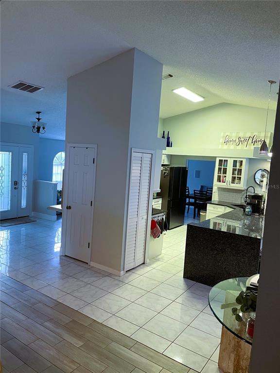 2571 Running Oak Court Spring Hill, FL 34608 - Photo 2 of 37 a living room with furniture and a table
