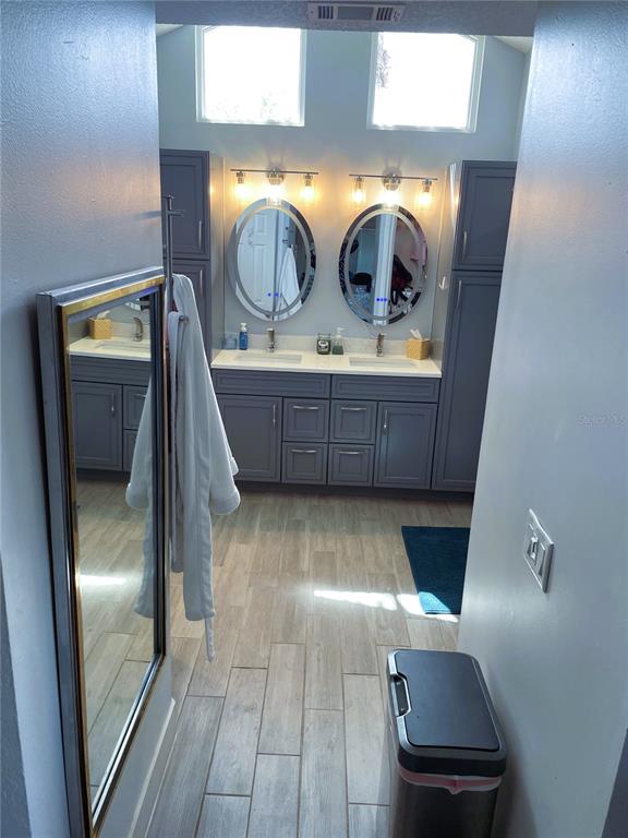 2571 Running Oak Court Spring Hill, FL 34608 - Photo 27 of 37 a bathroom with mirror two sink and toilet