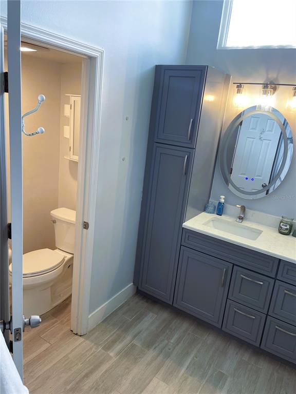 2571 Running Oak Court Spring Hill, FL 34608 - Photo 29 of 37 a bathroom with a sink and a mirror