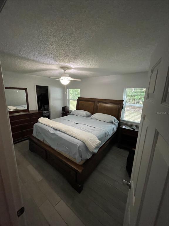2571 Running Oak Court Spring Hill, FL 34608 - Photo 30 of 37 a bedroom with a bed and a mirror