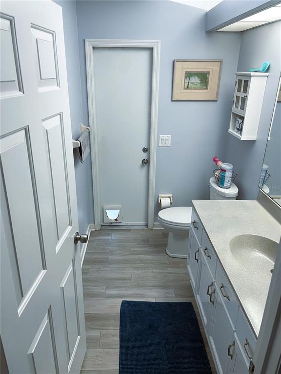 2571 Running Oak Court Spring Hill, FL 34608 - Photo 31 of 37 a bathroom with a sink a toilet and a mirror