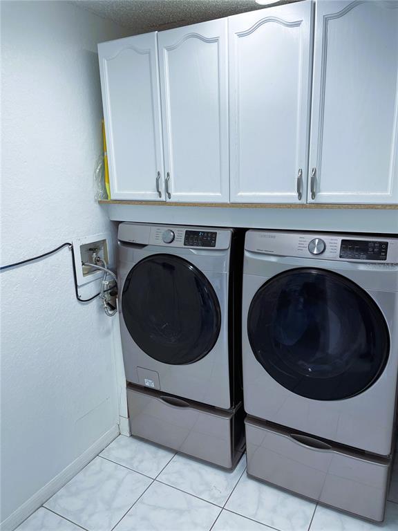 2571 Running Oak Court Spring Hill, FL 34608 - Photo 35 of 37 a utility room with dryer and washer