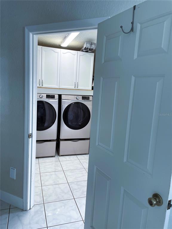 2571 Running Oak Court Spring Hill, FL 34608 - Photo 36 of 37 a utility room with dryer and washer