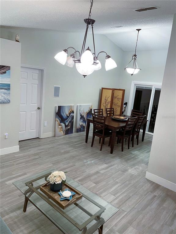 2571 Running Oak Court Spring Hill, FL 34608 - Photo 4 of 37 a living room with furniture and wooden floor