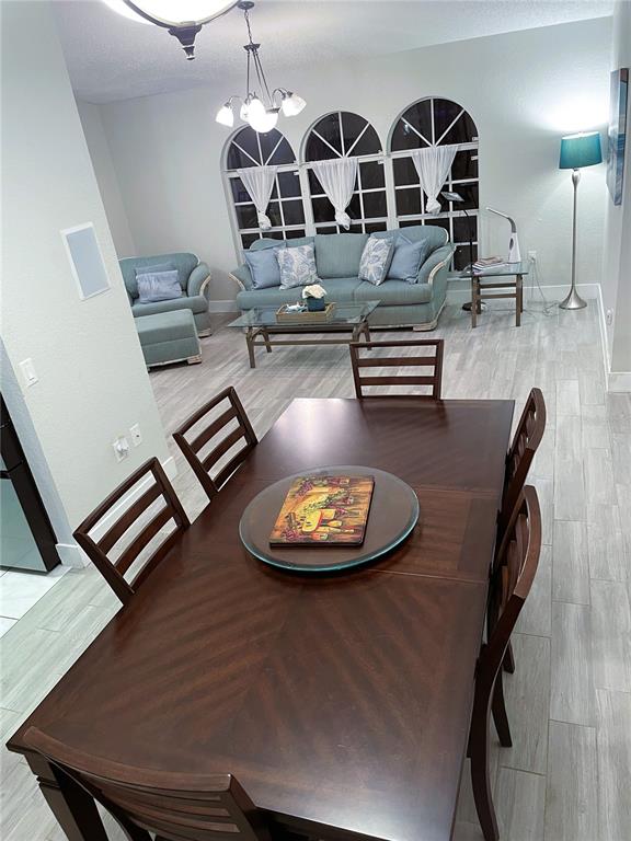 2571 Running Oak Court Spring Hill, FL 34608 - Photo 5 of 37 a dining room with furniture and wooden floor
