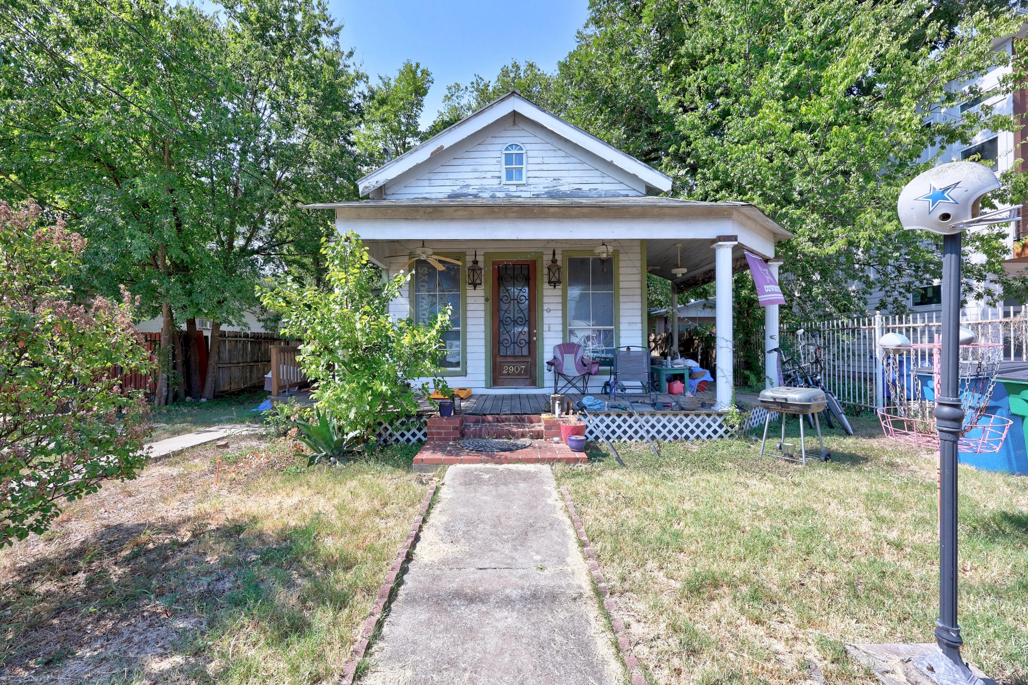 2907 East 5th Street Austin, TX 78702 - Photo 1 of 22 a front view of a house with a yard