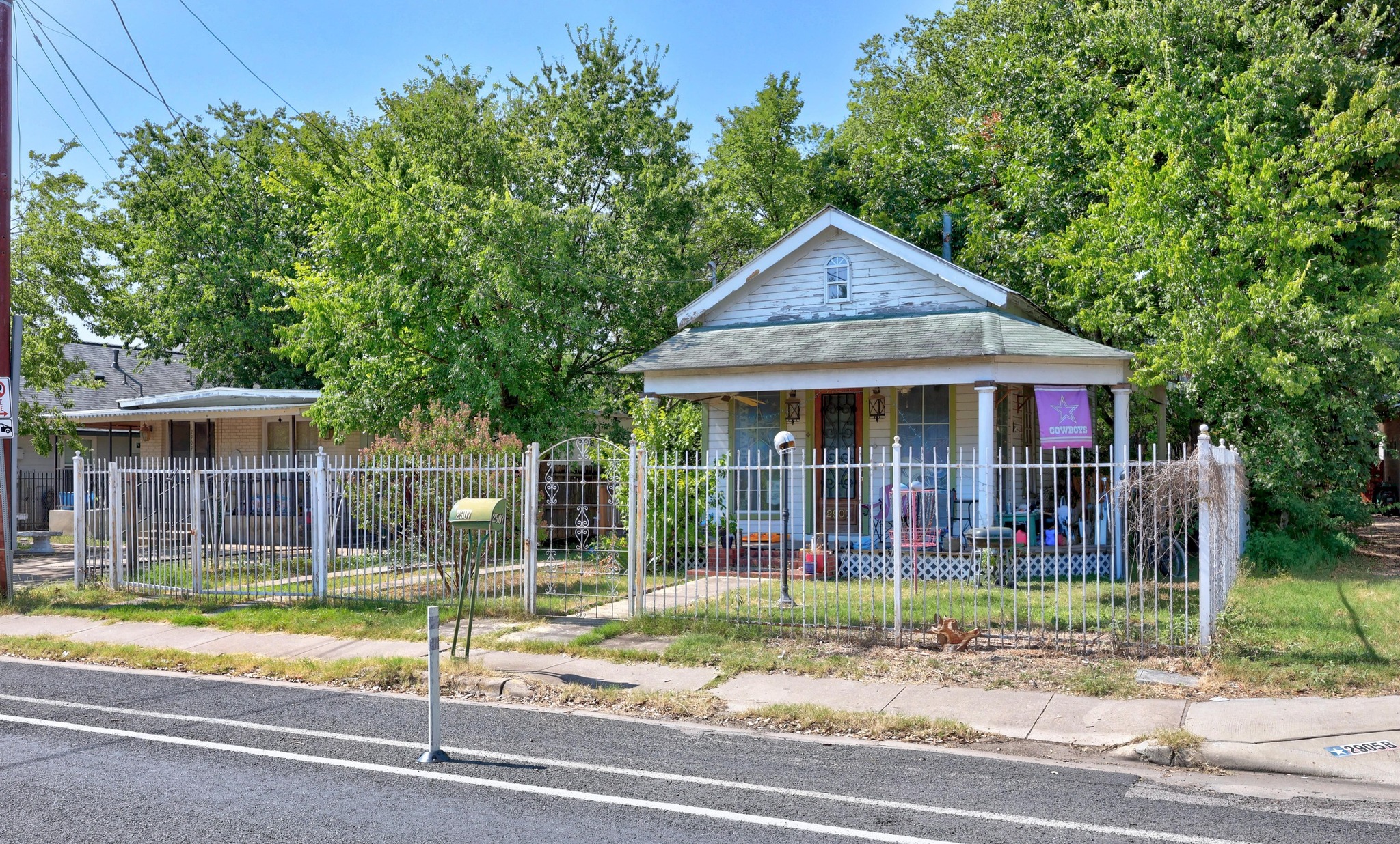 2907 East 5th Street Austin, TX 78702 - Photo 13 of 22 a view of a house with a small yard plants and large tree