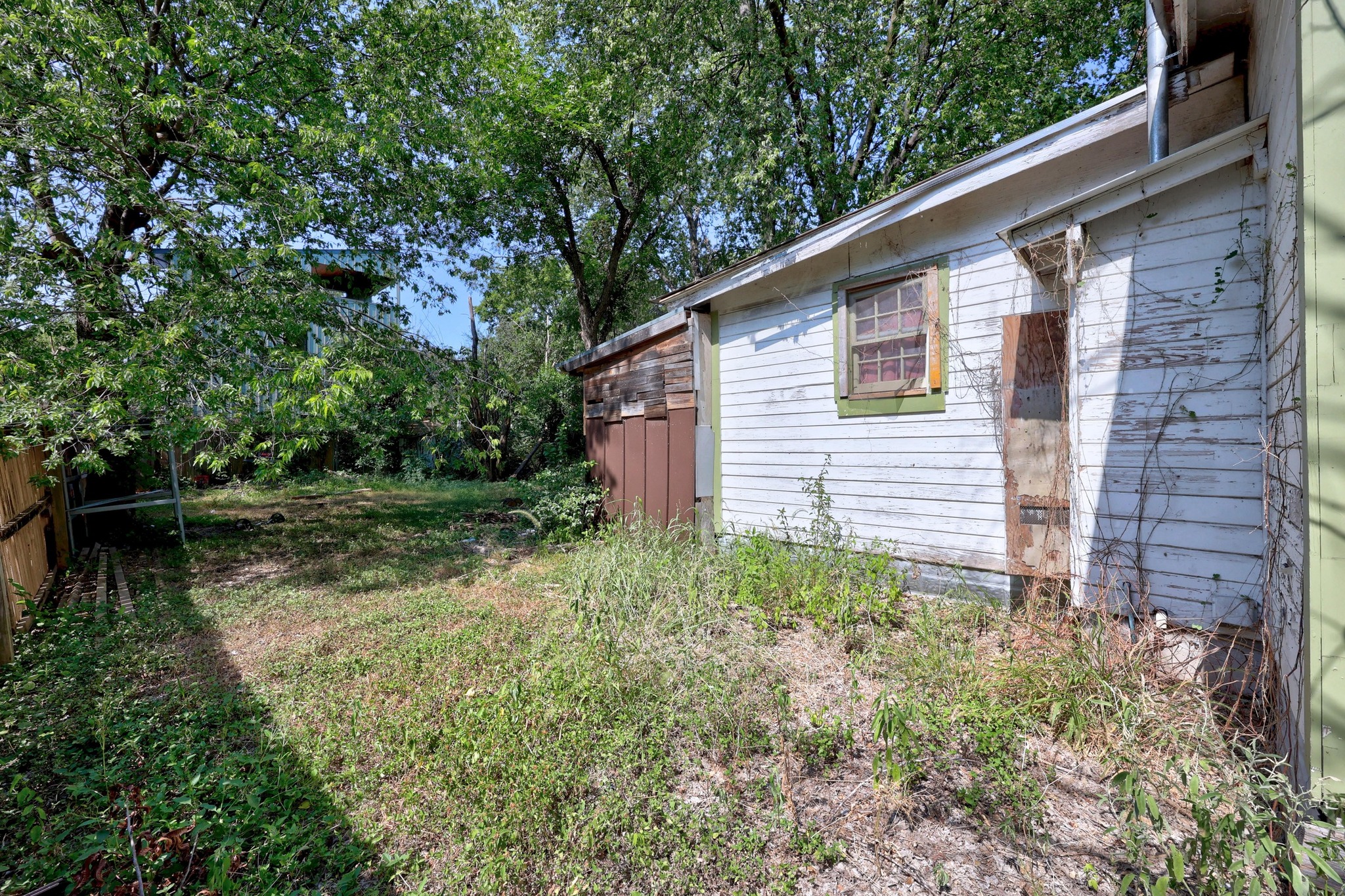 2907 East 5th Street Austin, TX 78702 - Photo 22 of 22 a backyard of a house with lots of green space