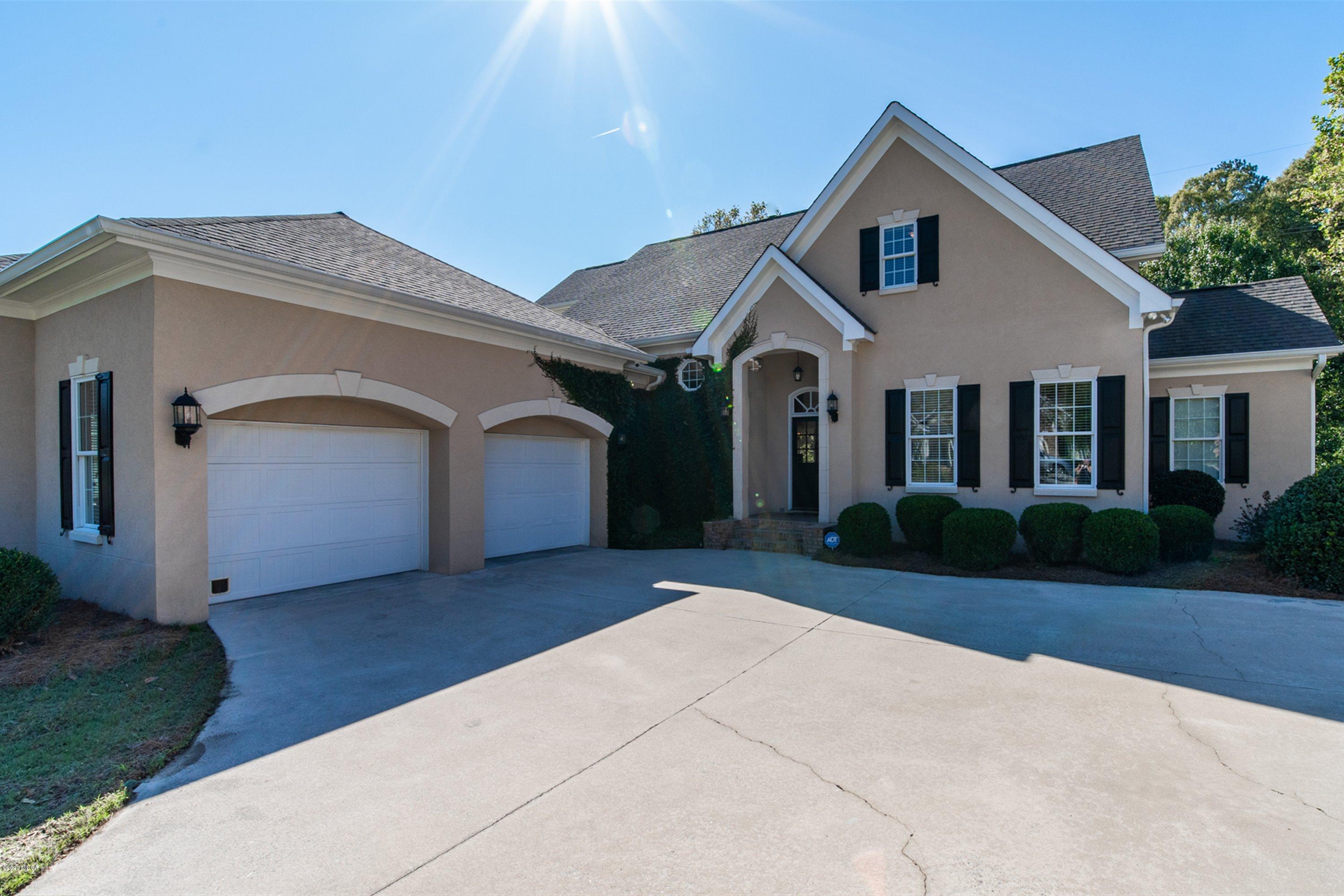 5022 Tucker Ridge Macon, GA 31210 - Photo 2 of 38 a front view of a house with a yard and garage