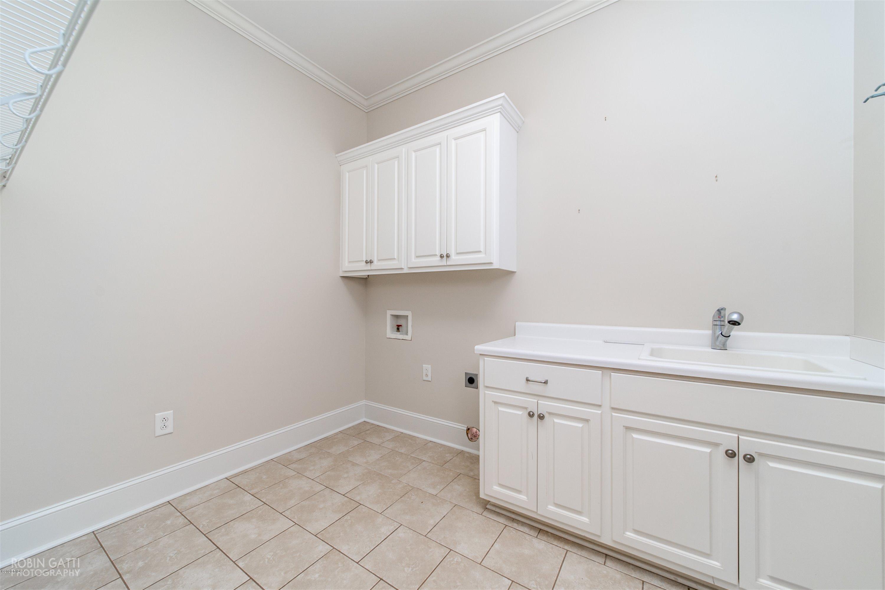 5022 Tucker Ridge Macon, GA 31210 - Photo 13 of 38 a room with a sink and cabinets