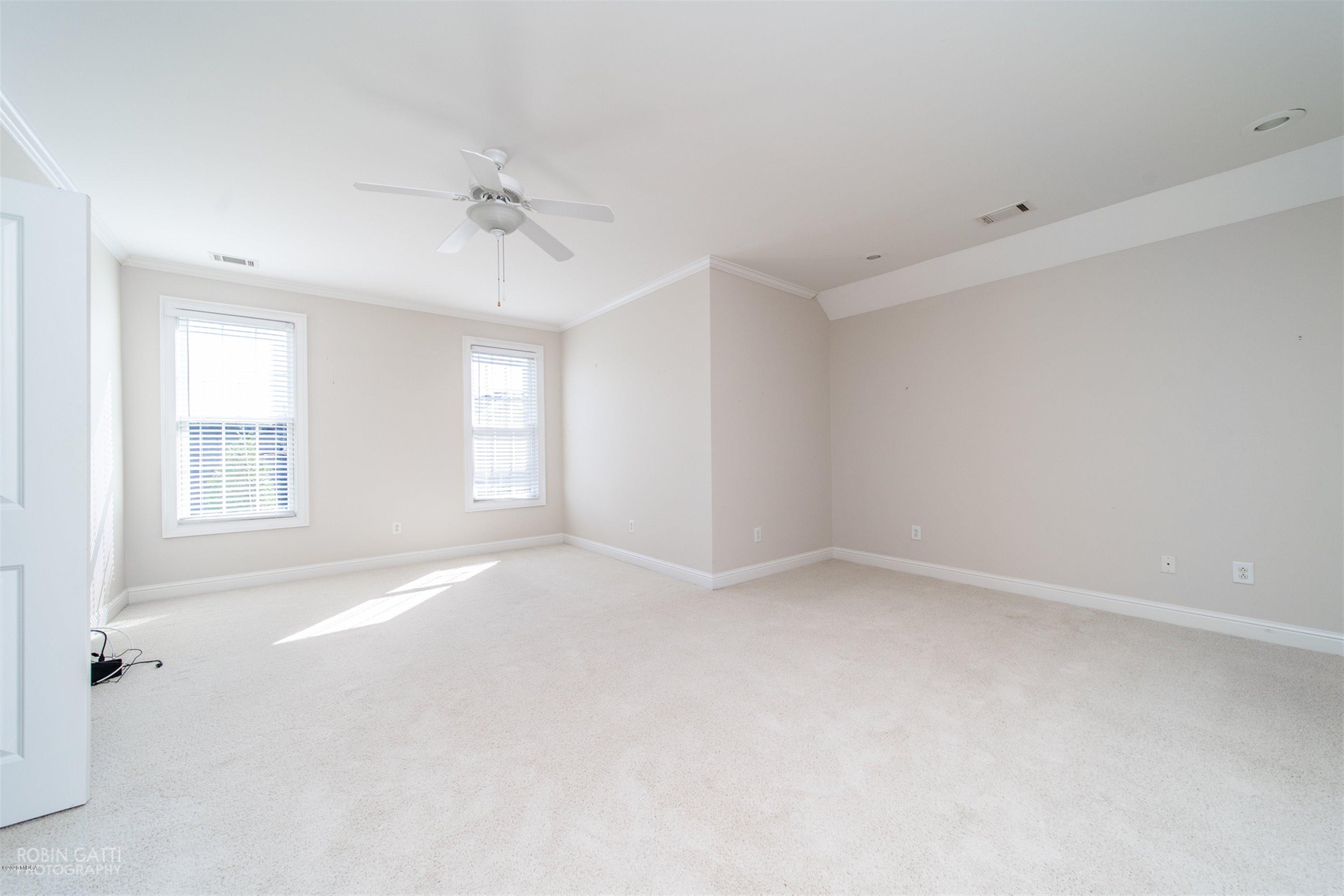 5022 Tucker Ridge Macon, GA 31210 - Photo 21 of 38 an empty room with windows and ceiling fan