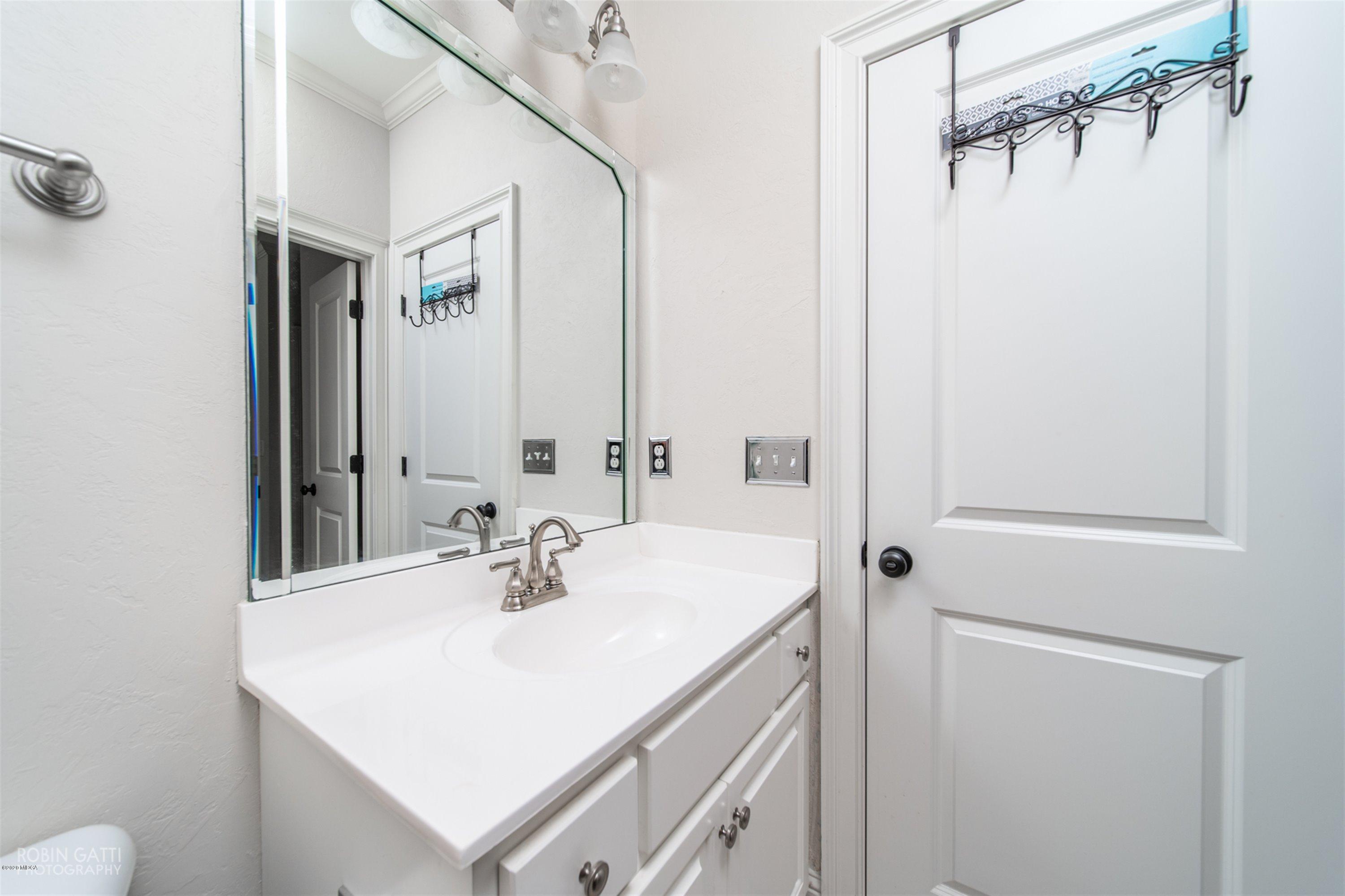 5022 Tucker Ridge Macon, GA 31210 - Photo 26 of 38 a bathroom with a sink vanity and a mirror