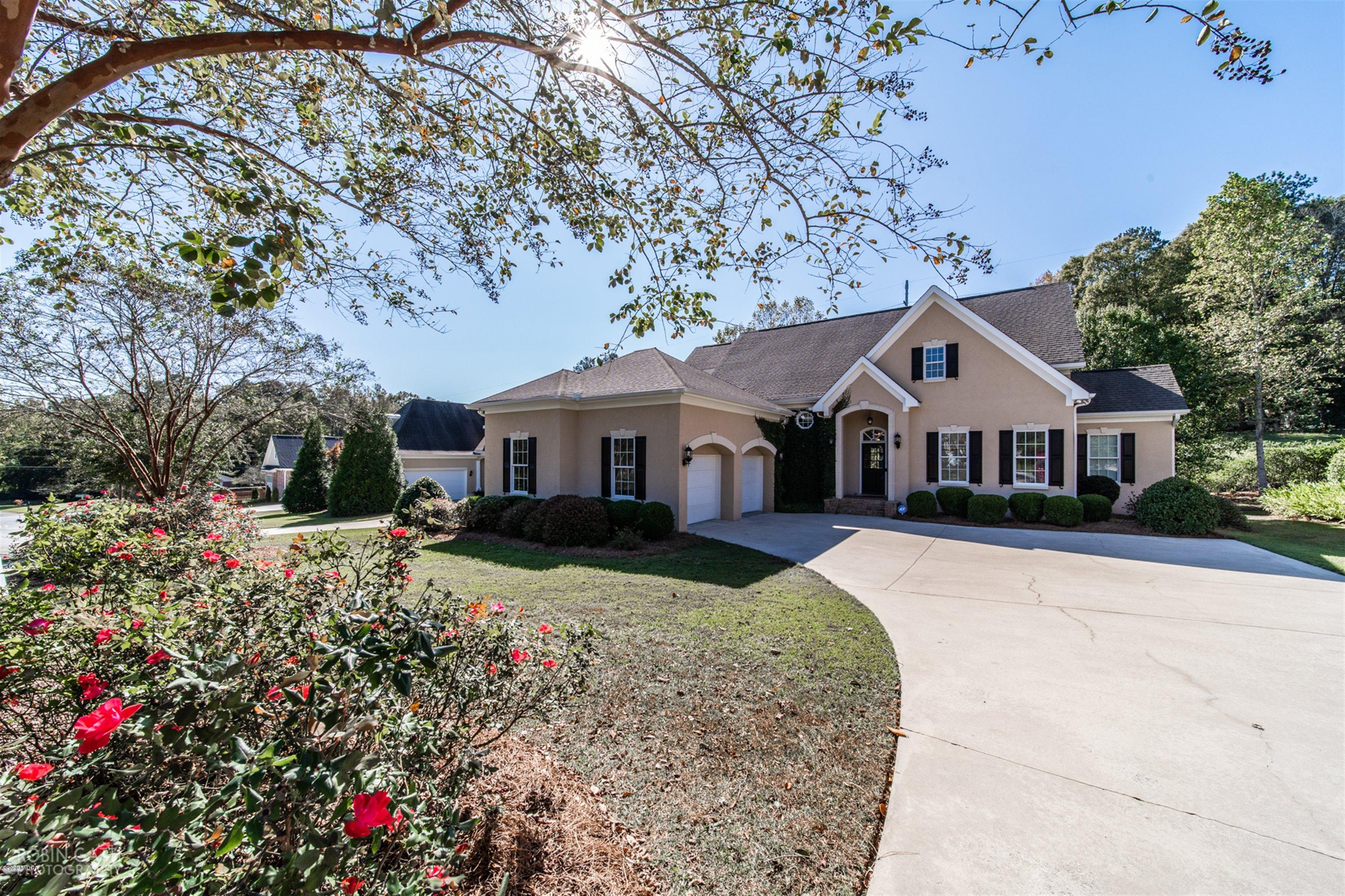 5022 Tucker Ridge Macon, GA 31210 - Photo 30 of 38 a front view of a house with yard and green space