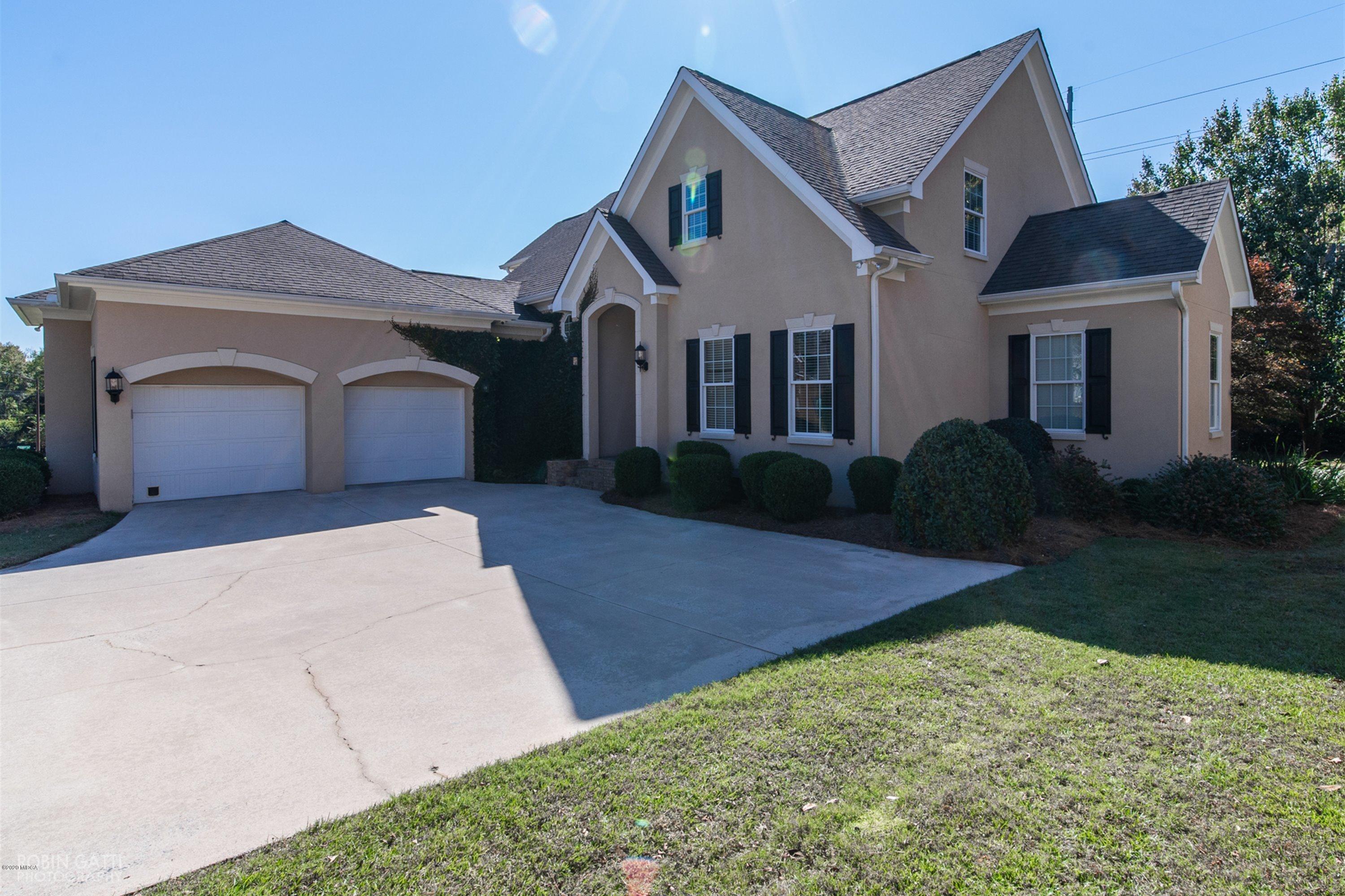 5022 Tucker Ridge Macon, GA 31210 - Photo 31 of 38 a front view of a house with a yard and garage