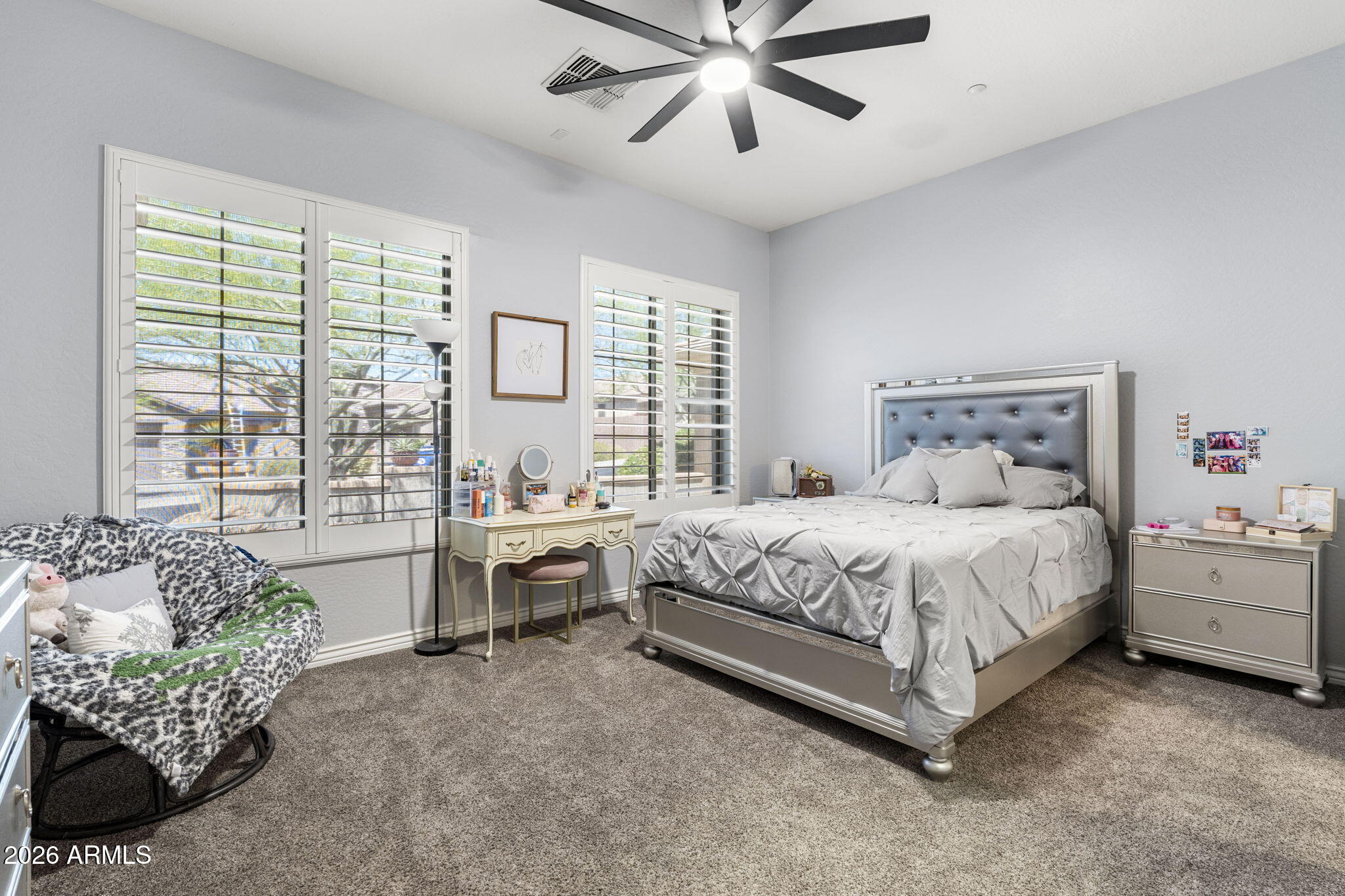 41619 North River Bend Road Anthem, AZ 85086 - Photo 5 of 84 a spacious bedroom with a bed and a chandelier