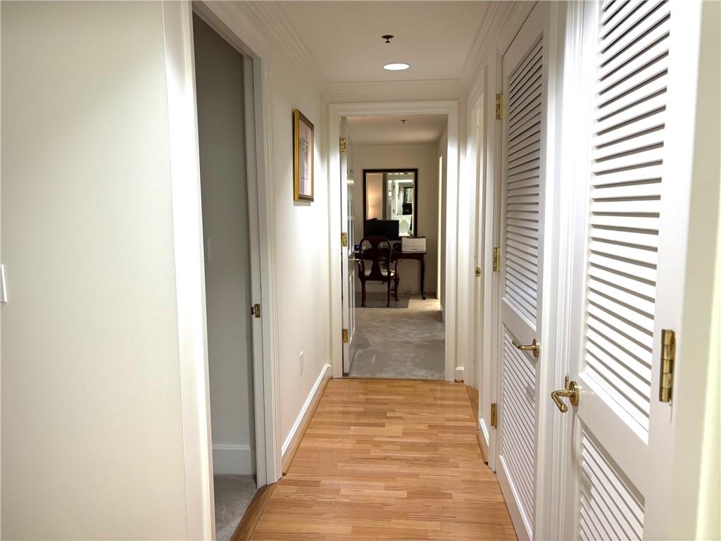 75 14th Street Northeast, Unit 3650 Atlanta, GA 30309 - Photo 12 of 25 a view of a hallway with wooden floor and a bathroom