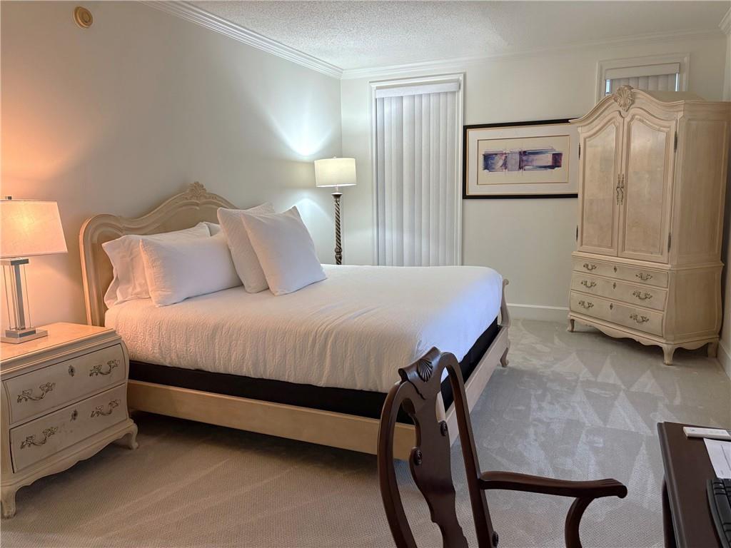 75 14th Street Northeast, Unit 3650 Atlanta, GA 30309 - Photo 14 of 25 a bed room with a bed and a television