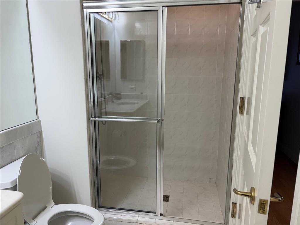 75 14th Street Northeast, Unit 3650 Atlanta, GA 30309 - Photo 21 of 25 a bathroom with a glass shower door