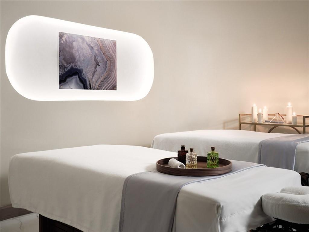 75 14th Street Northeast, Unit 3650 Atlanta, GA 30309 - Photo 25 of 25 a bedroom with a bed and a chair