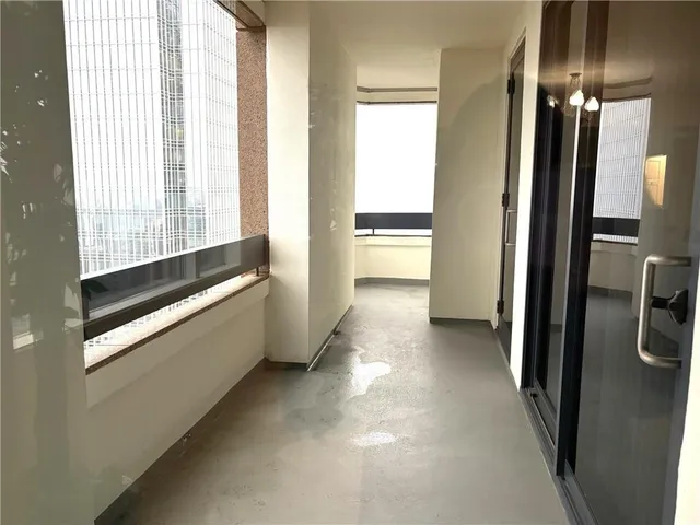 a view of a kitchen with a sink and refrigerator
