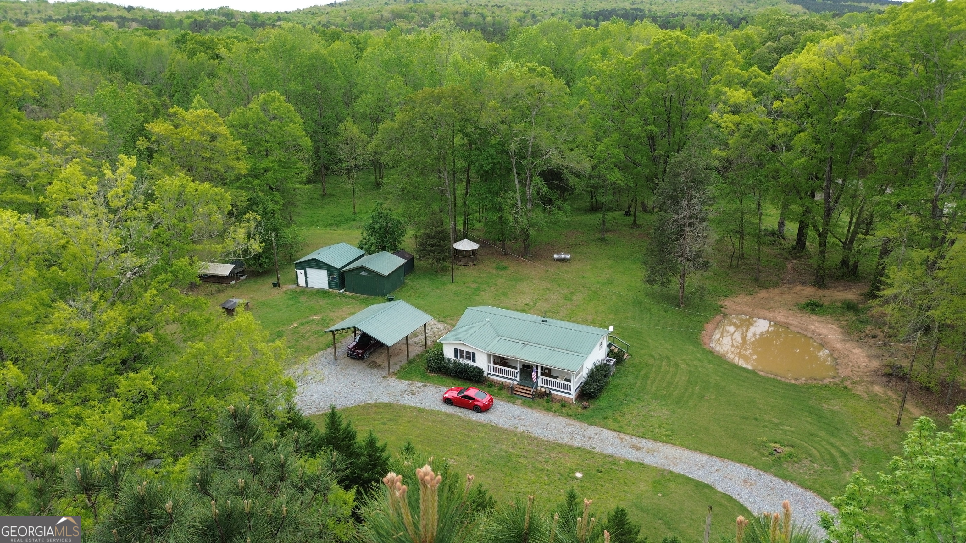 969 Flowers Road Molena, GA 30258 - Photo 5 of 16 an aerial view of a house with pool outdoor seating and yard