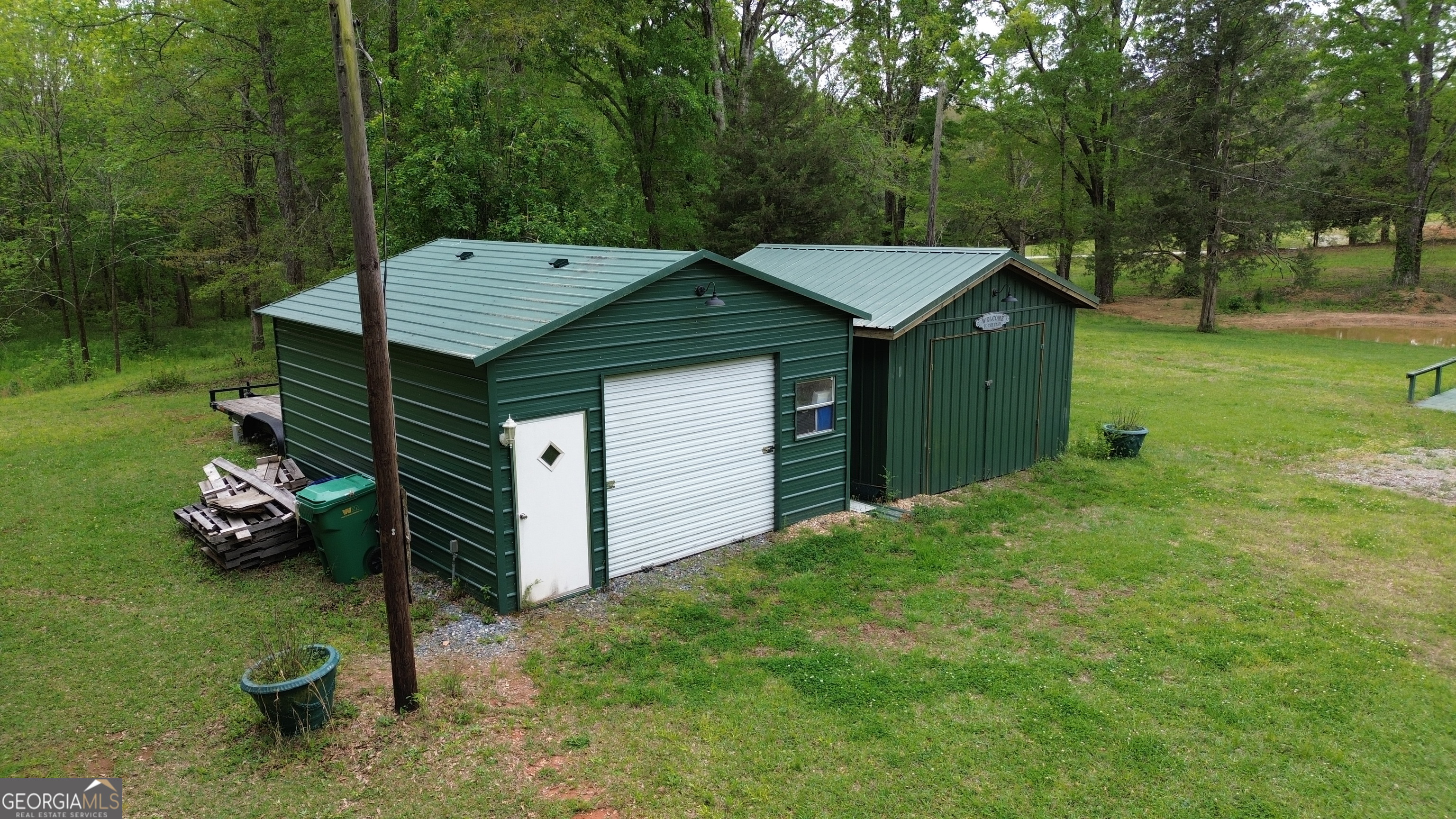 969 Flowers Road Molena, GA 30258 - Photo 8 of 16 a view of a house with a backyard and trees