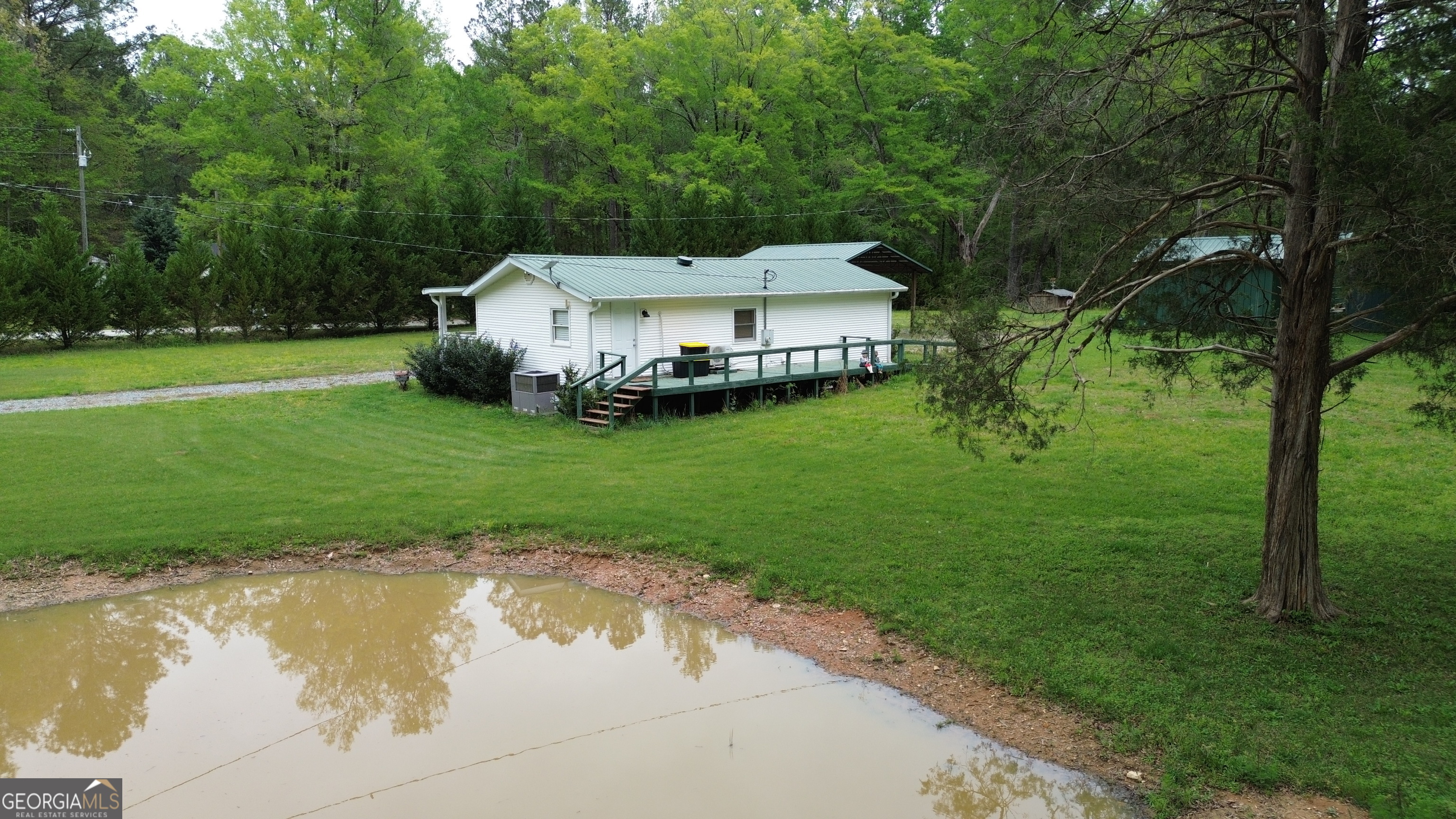 969 Flowers Road Molena, GA 30258 - Photo 10 of 16 a view of a house with a yard