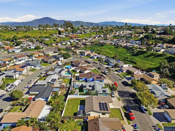 an aerial view of a city with lots of residential buildings