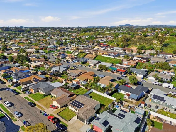 an aerial view of residential houses with outdoor space