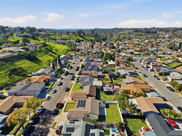 an aerial view of residential houses with outdoor space