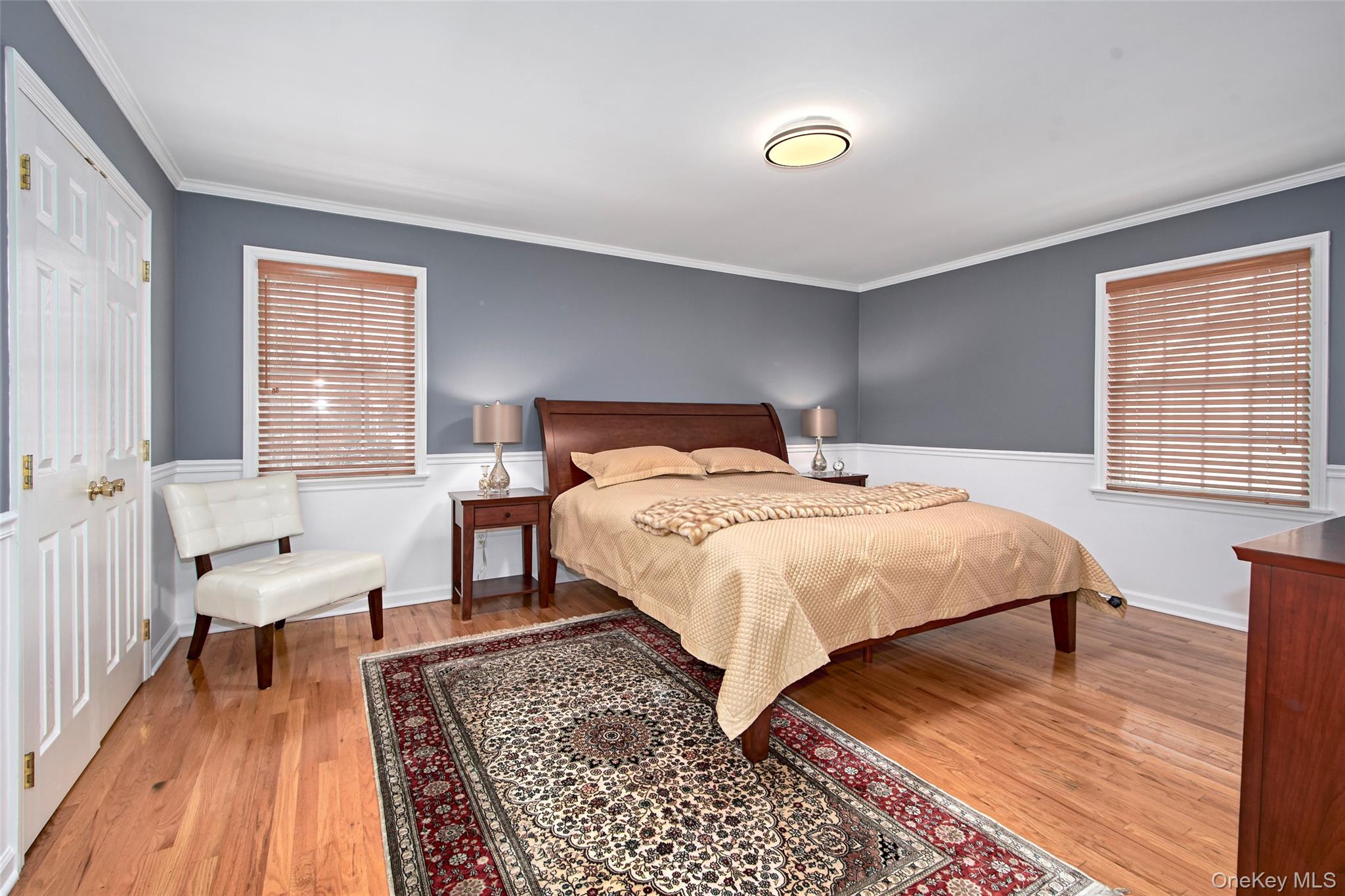 130 Wappanocca Avenue Rye, NY 10580 - Photo 9 of 16 Bedroom featuring ornamental molding and light wood-type flooring