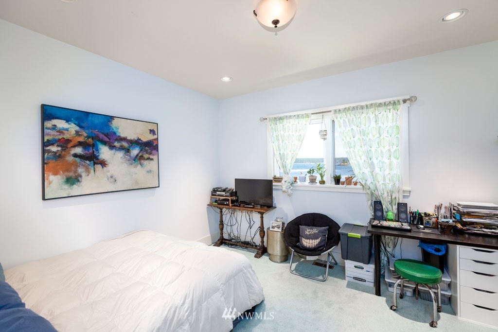 2397 Turn Point Road Friday Harbor, WA 98250 - Photo 22 of 25 a bed room with a bed and a chair