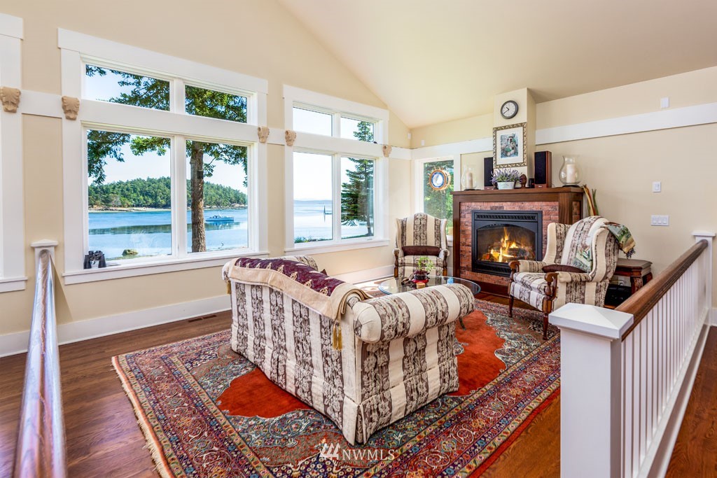 2397 Turn Point Road Friday Harbor, WA 98250 - Photo 8 of 25 a living room with furniture and a fireplace