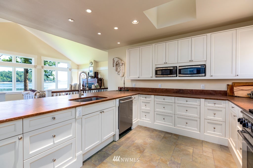 2397 Turn Point Road Friday Harbor, WA 98250 - Photo 10 of 25 a kitchen with sink cabinets and microwave