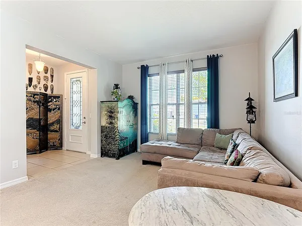a kitchen with a dining table cabinets appliances and a counter top space