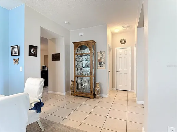 a living room with lots of furniture and a large window