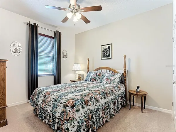 a bathroom with a tub a mirror and a shower
