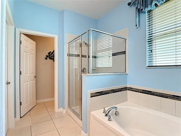 an aerial view of a house with a big yard