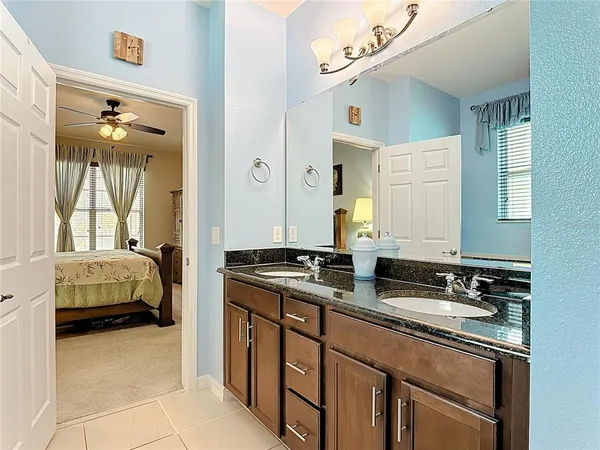 an aerial view of residential houses with outdoor space and city view