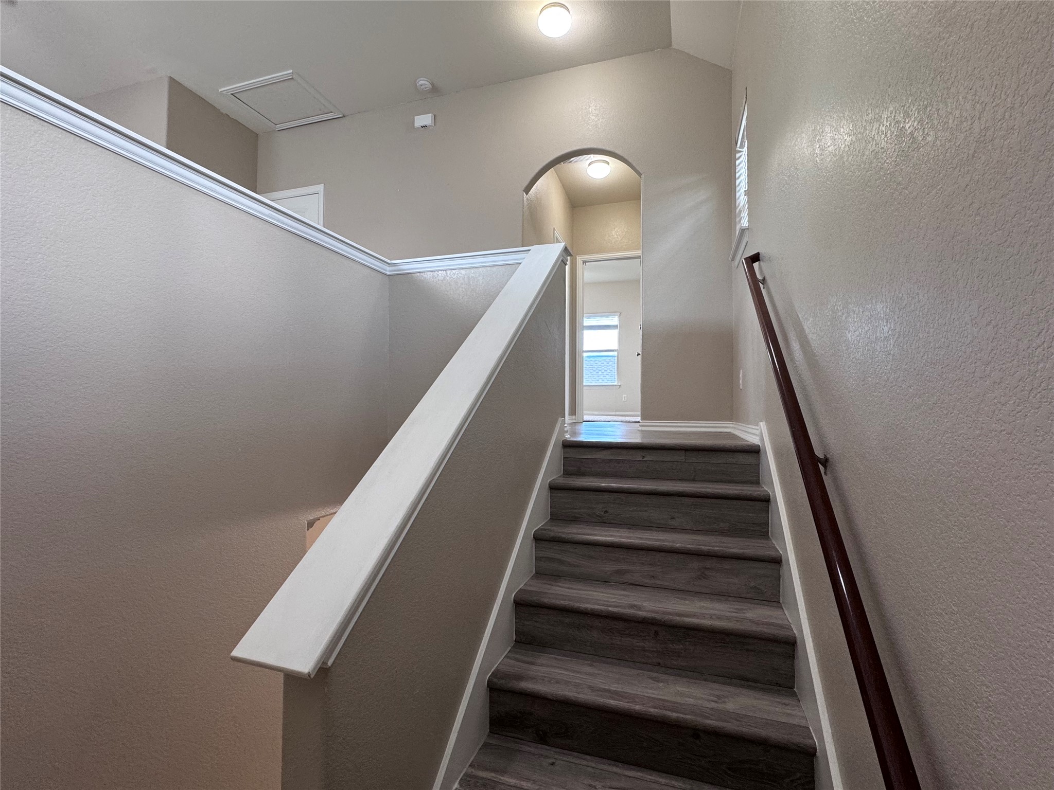 2605 Rough Berry Road Pflugerville, TX 78660 - Photo 18 of 40 Ascend to the upper level on durable wood-look flooring leading to additional living spaces.