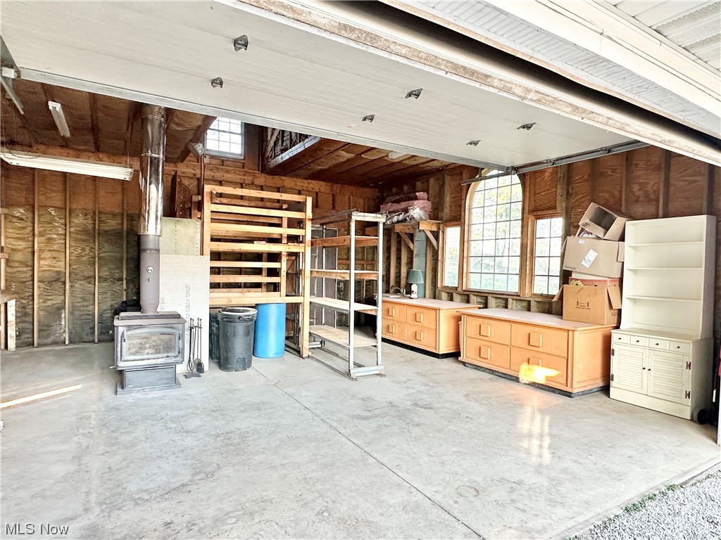 6130 Renninger Road New Franklin, OH 44319 - Photo 25 of 30 workshop with a wood burning stove