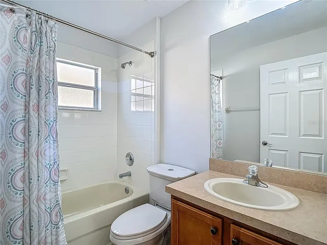 a kitchen with stainless steel appliances granite countertop a stove a microwave and a sink